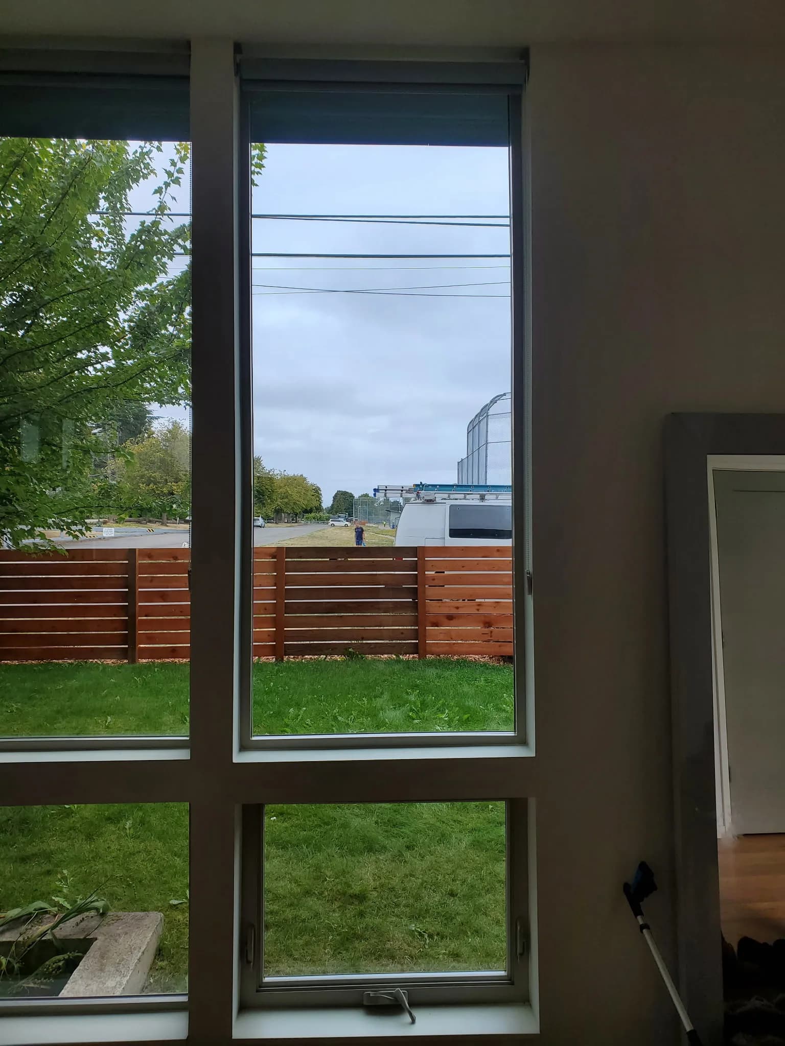 Interior view through a tall residential picture window after glass replacement